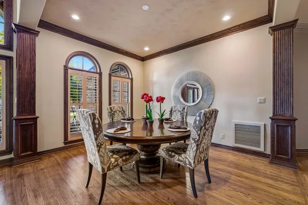 a living room with furniture and a bookshelf