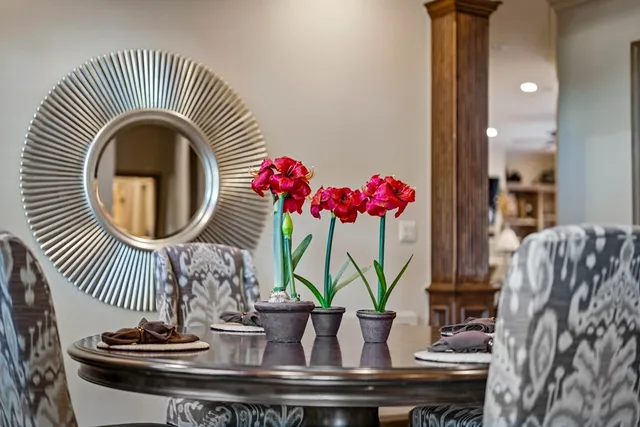 a spacious bedroom with a bed a couch and a window