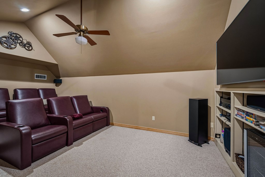 2409 West Commerce Street San Saba, TX 76877 - Photo 30 of 96 a living room with furniture and a flat screen tv