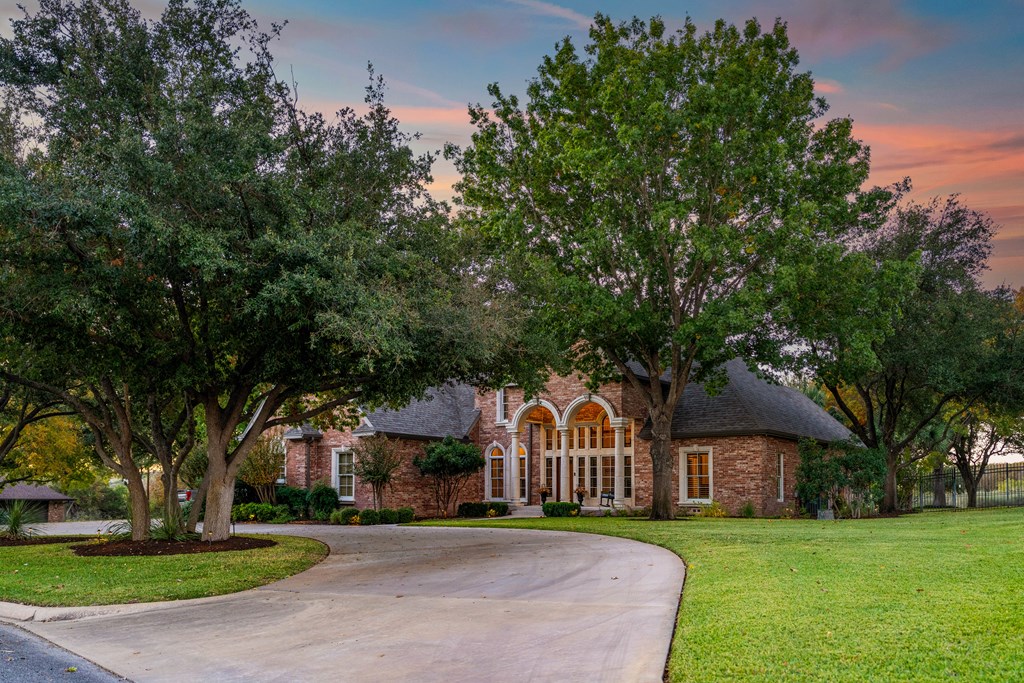 2409 West Commerce Street San Saba, TX 76877 - Photo 3 of 96 a front view of a house with a garden