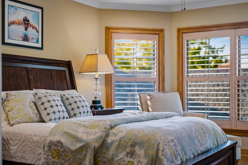 2409 West Commerce Street San Saba, TX 76877 - Photo 34 of 96 a bedroom with a large bed and a window