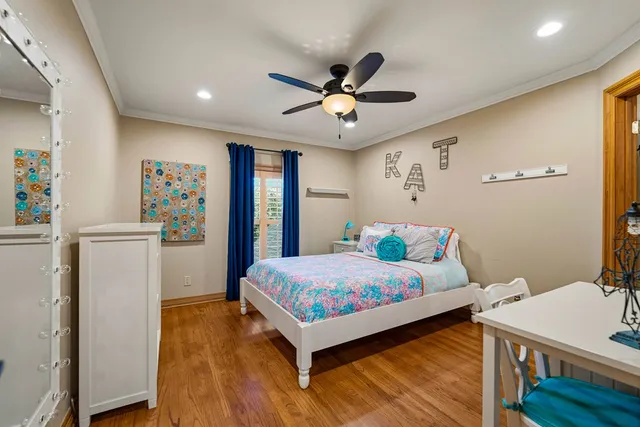 a view of a patio with table and chairs and potted plants
