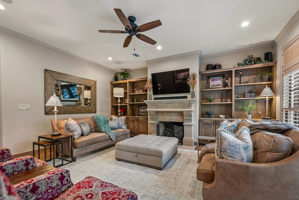 2409 West Commerce Street San Saba, TX 76877 - Photo 10 of 96 a living room with furniture fireplace and flat screen tv