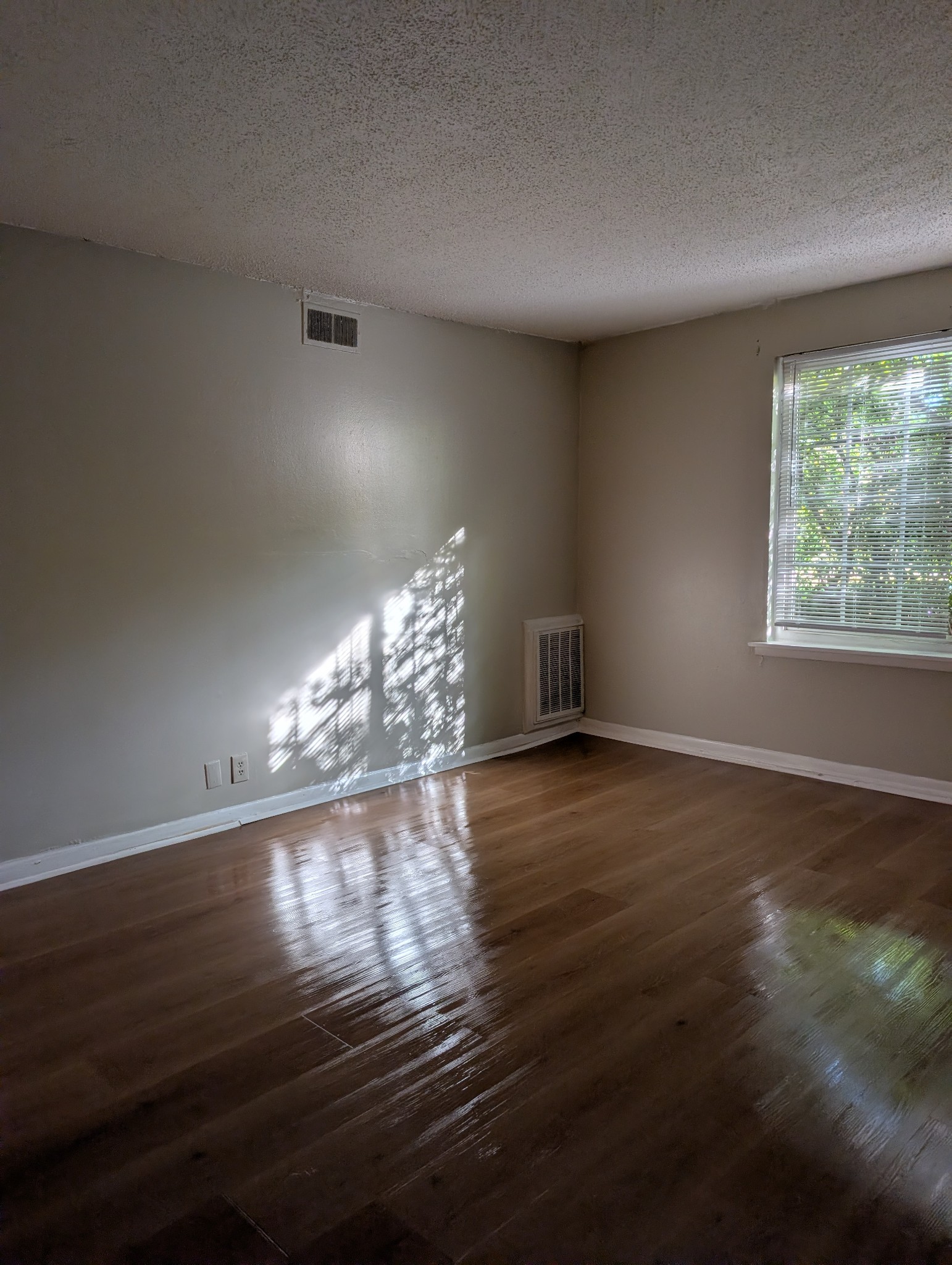 441 Harding Place, Unit B2 Nashville, TN 37211 - Photo 4 of 12 a view of empty room with wooden floor and fan
