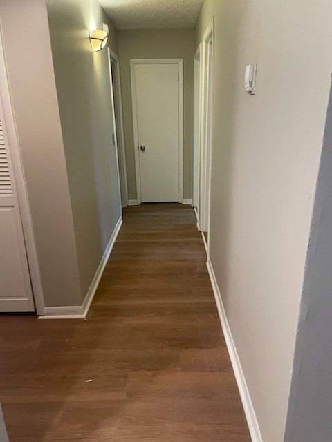 441 Harding Place, Unit B2 Nashville, TN 37211 - Photo 9 of 12 a view of a hallway with wooden floor and staircase