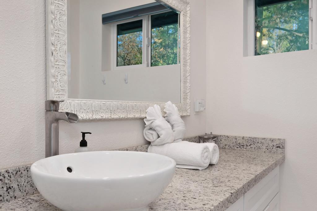 3191 Fort Jim Road Placerville, CA 95667 - Photo 14 of 30 a bathroom with a granite countertop sink and bathtub