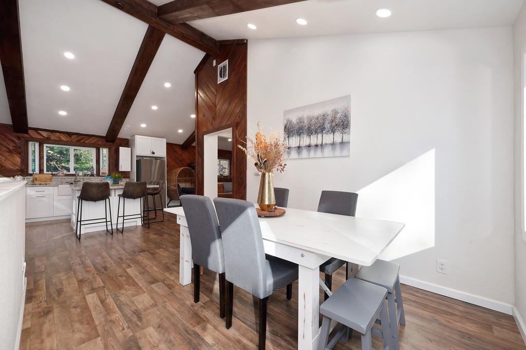 3191 Fort Jim Road Placerville, CA 95667 - Photo 16 of 30 a view of a dining room with furniture and wooden floor