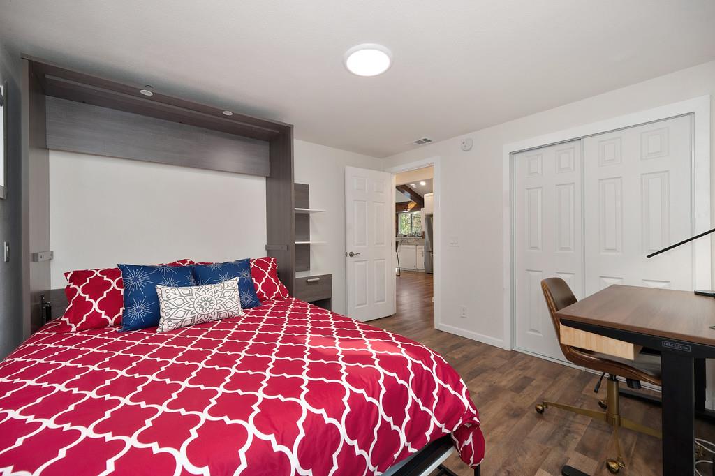 3191 Fort Jim Road Placerville, CA 95667 - Photo 28 of 30 a bedroom with a large bed and a chair