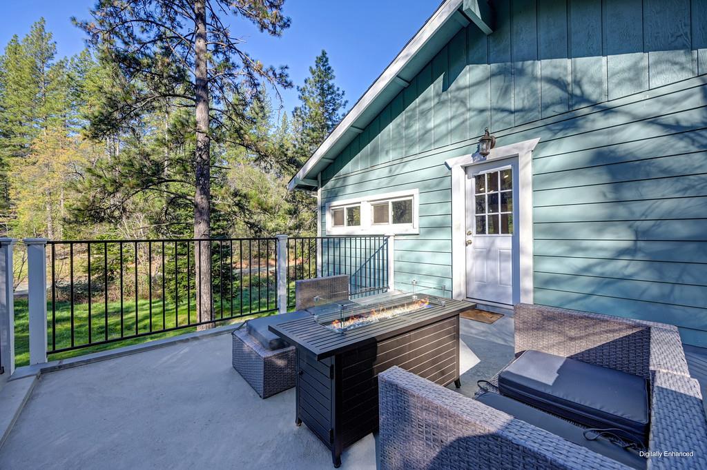 3191 Fort Jim Road Placerville, CA 95667 - Photo 29 of 30 a backyard of a house with wooden floor and outdoor seating