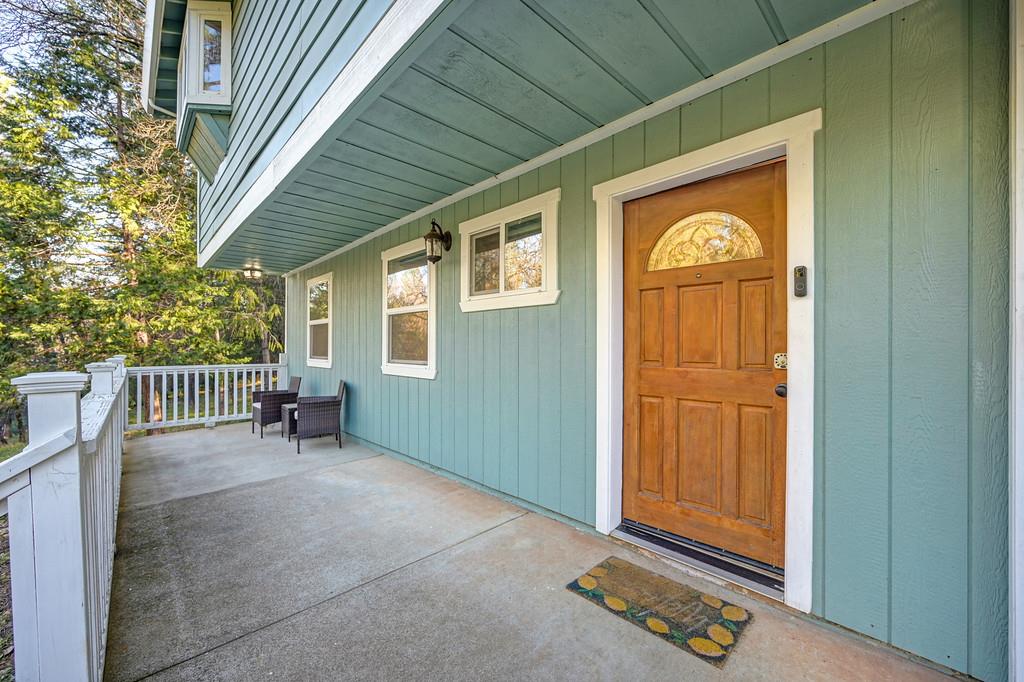 3191 Fort Jim Road Placerville, CA 95667 - Photo 6 of 30 a view of front door with porch and furniture
