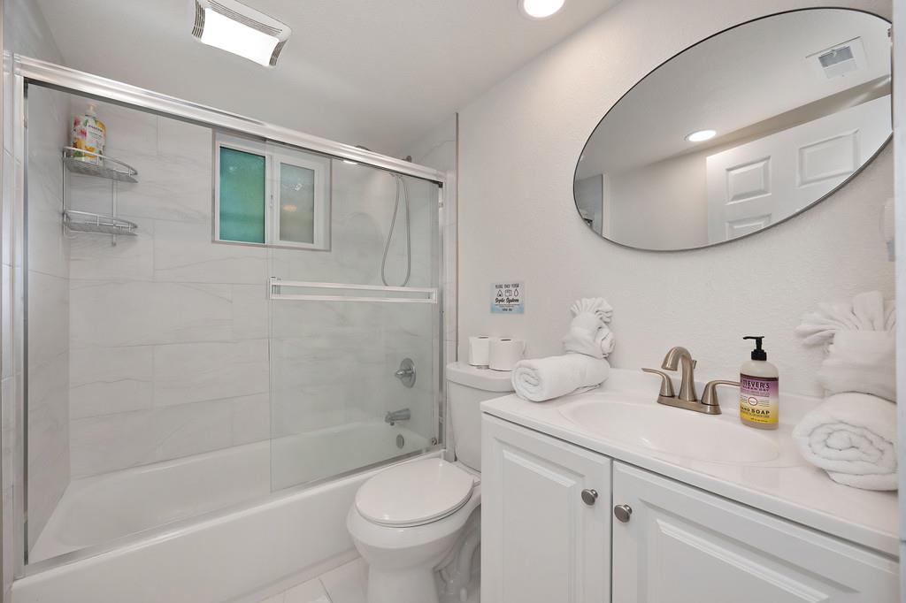 3191 Fort Jim Road Placerville, CA 95667 - Photo 9 of 30 a bathroom with a sink a toilet and a mirror