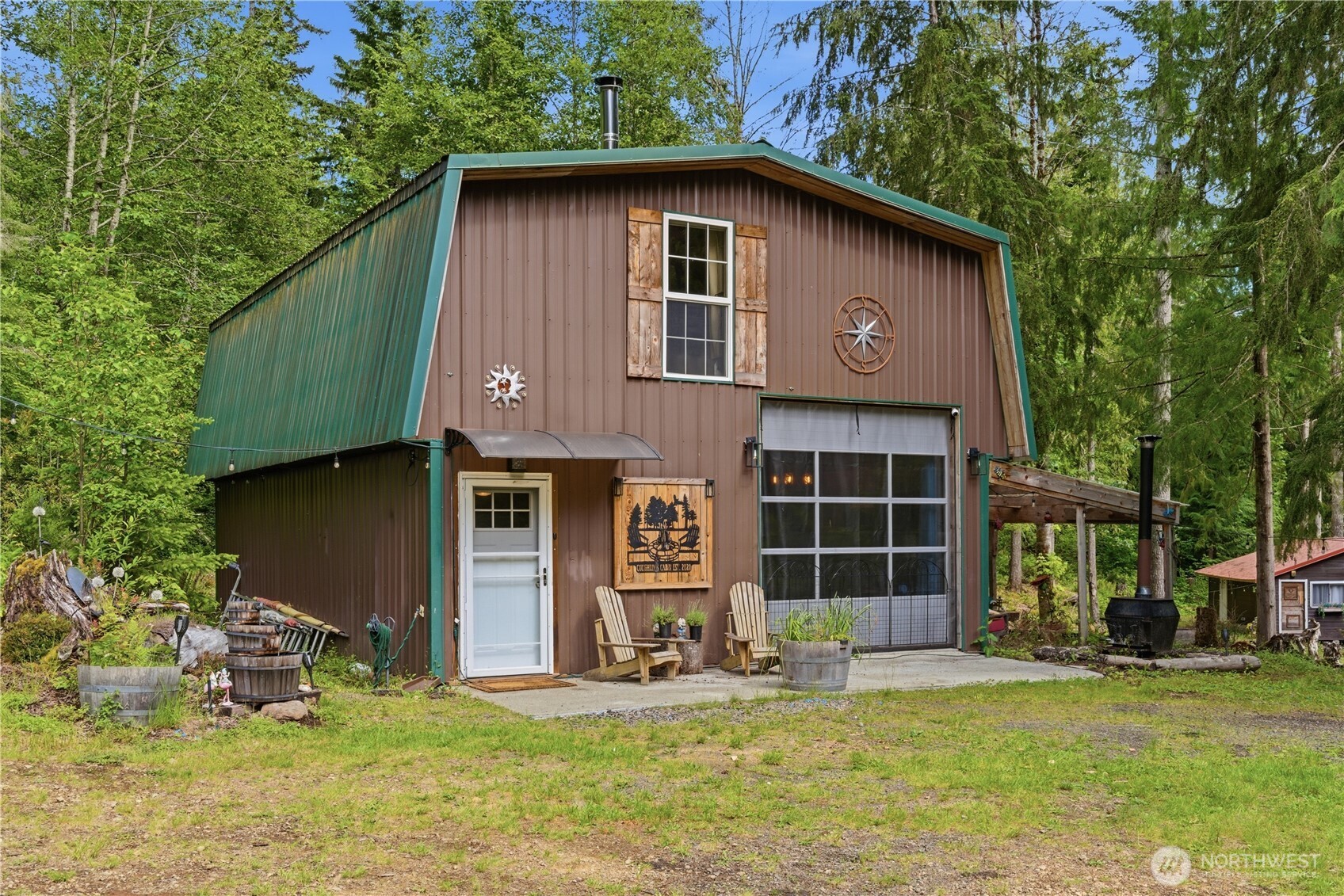 3320 Duckabush Road Brinnon, WA 98320 - Photo 35 of 38 a front view of a house with garden