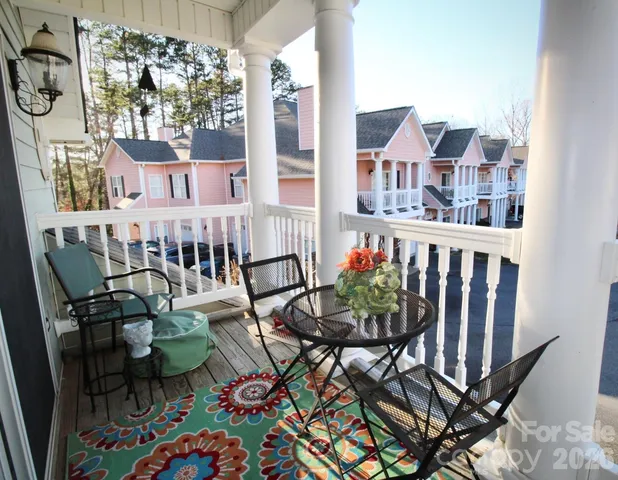 a view of a chairs and table in patio