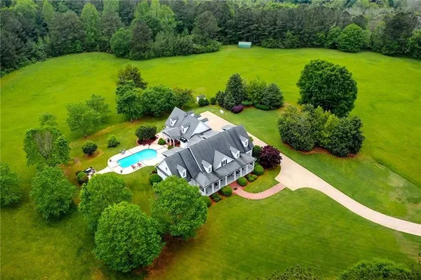 an aerial view of a house having yard