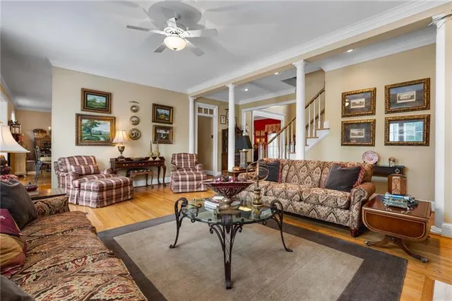 a living room with furniture potted plant and a window