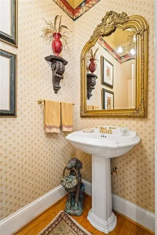 a bedroom with a bed and a mirror