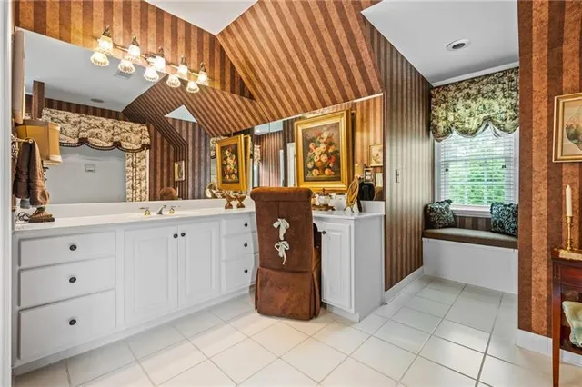 a bedroom with bed and window