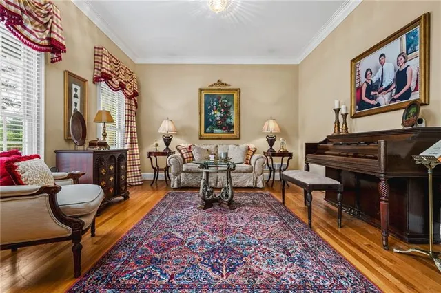 a living room with furniture and a piano