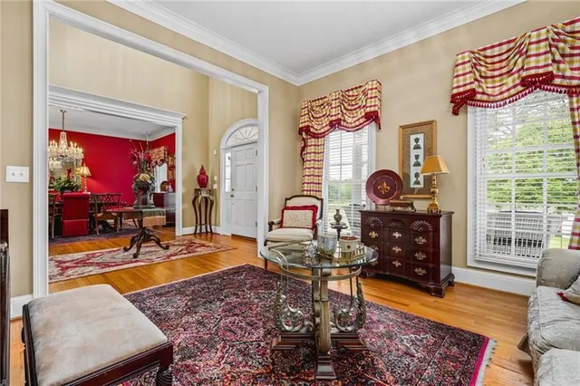 a bedroom with furniture and a window