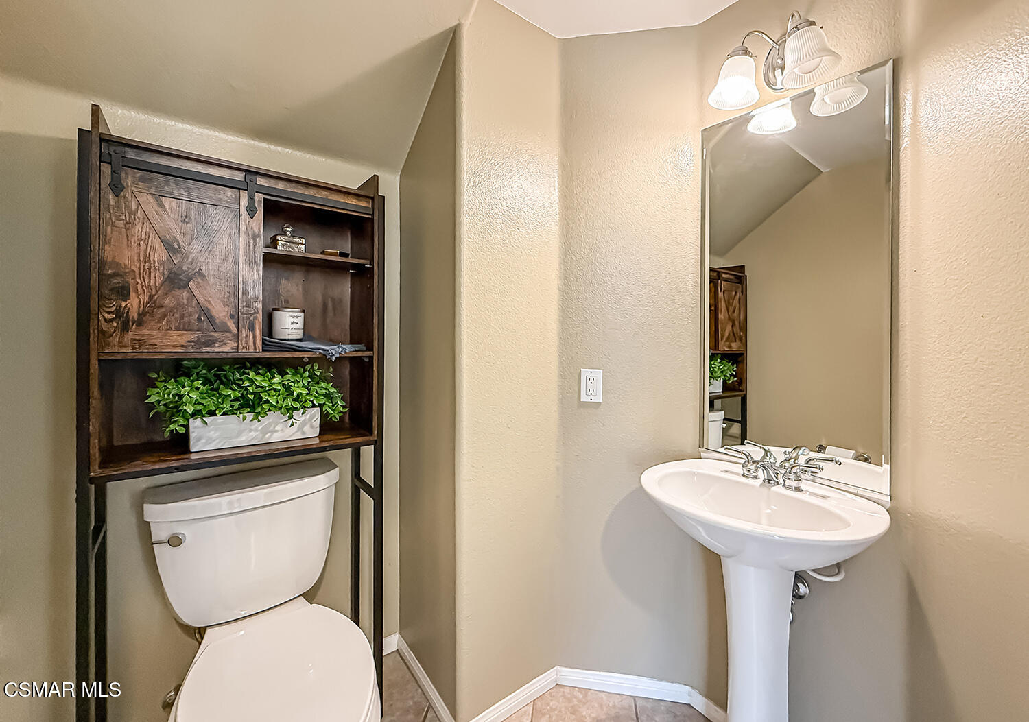 2511 Aurora Lane Simi Valley, CA 93063 - Photo 13 of 48 a bathroom with a toilet sink and mirror