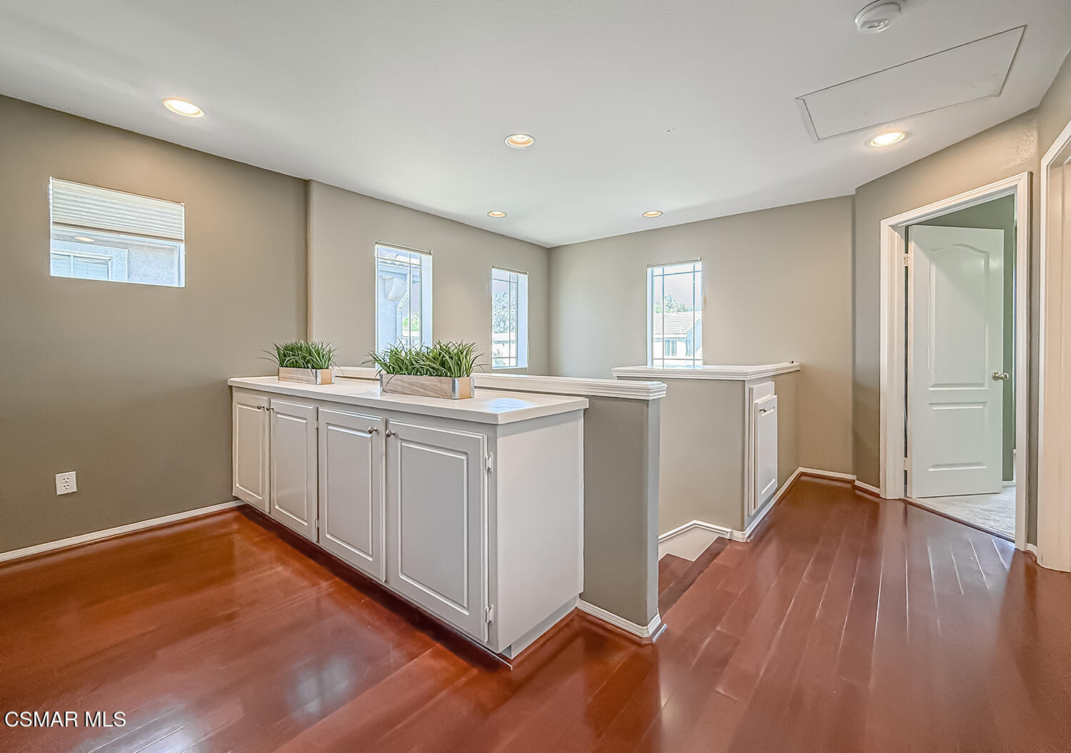 2511 Aurora Lane Simi Valley, CA 93063 - Photo 21 of 48 a kitchen with a sink cabinets and wooden floor