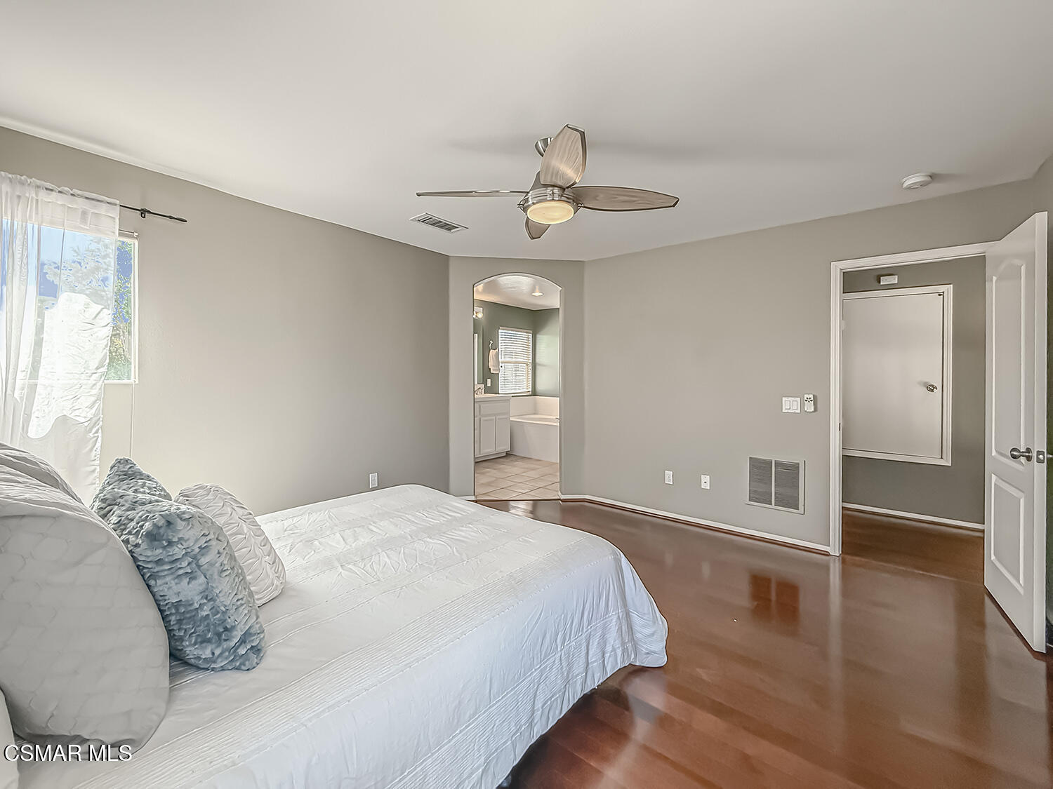 2511 Aurora Lane Simi Valley, CA 93063 - Photo 33 of 48 a spacious bedroom with a bed and wooden floor