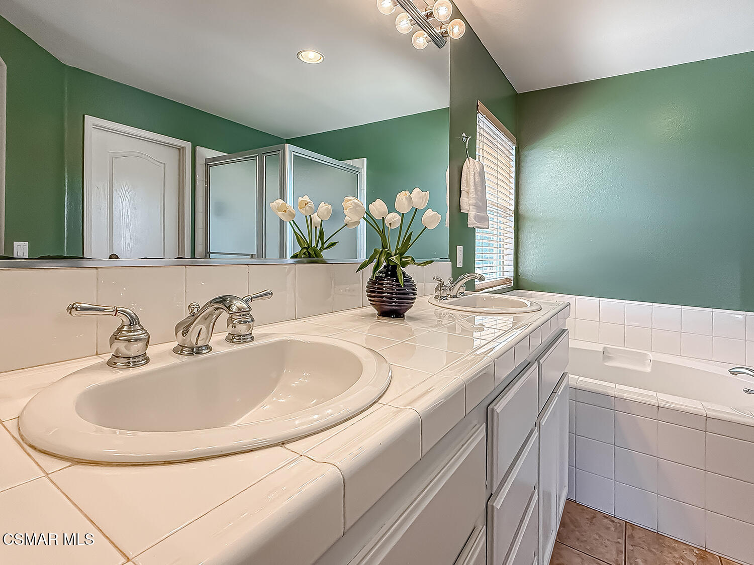 2511 Aurora Lane Simi Valley, CA 93063 - Photo 35 of 48 a bathroom with a double vanity sink and a mirror