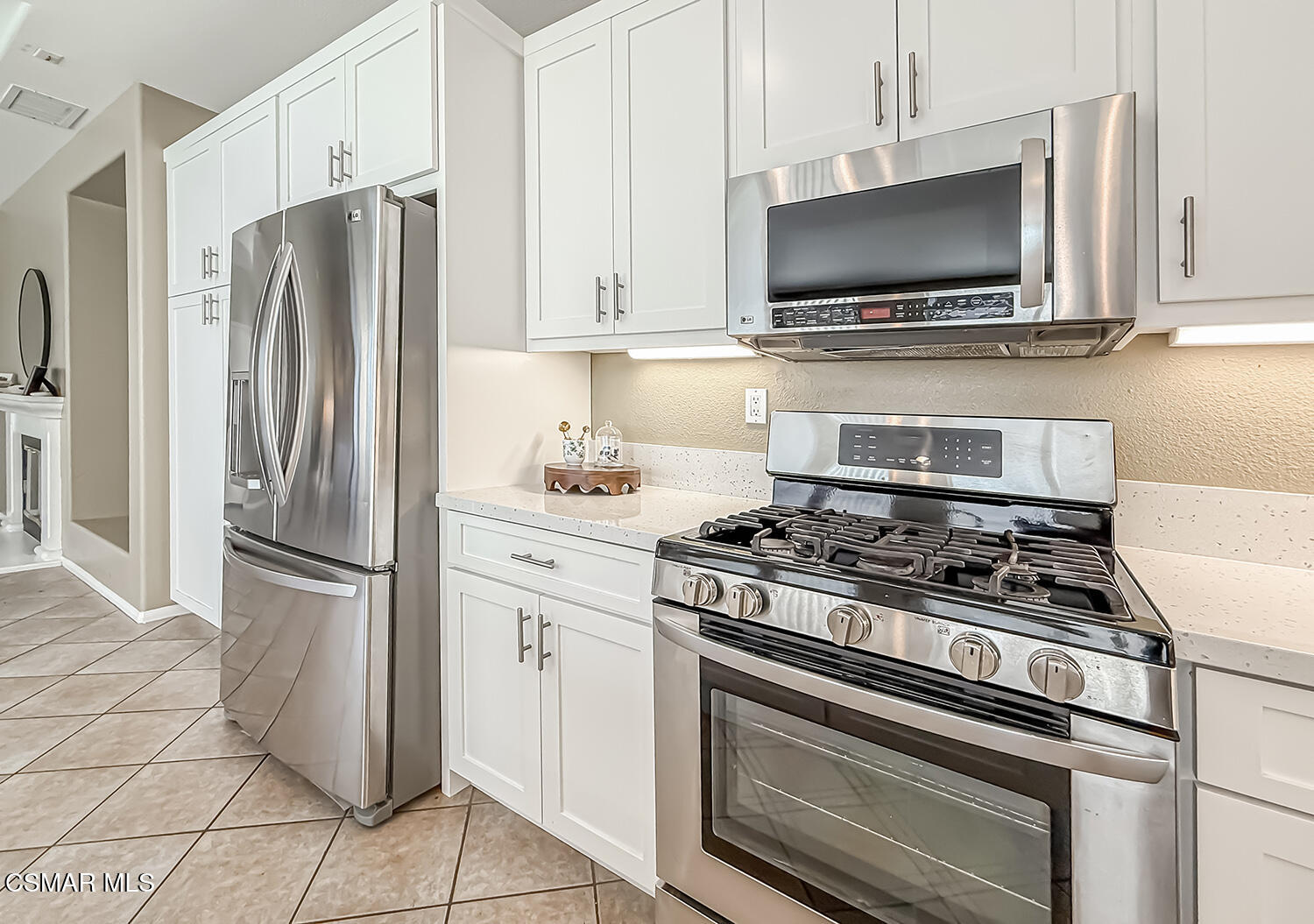 2511 Aurora Lane Simi Valley, CA 93063 - Photo 8 of 48 a kitchen with stainless steel appliances a refrigerator stove and microwave