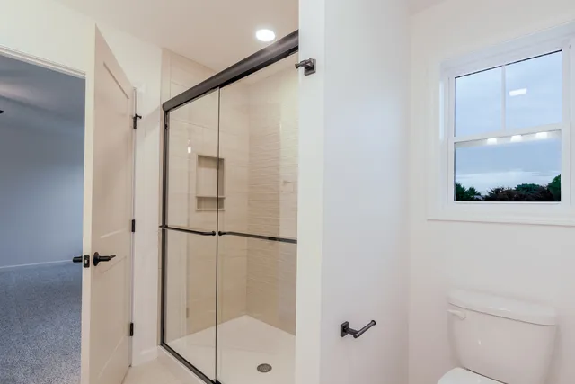 a view of an empty room with a window