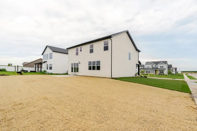 a house with swimming pool in front of it