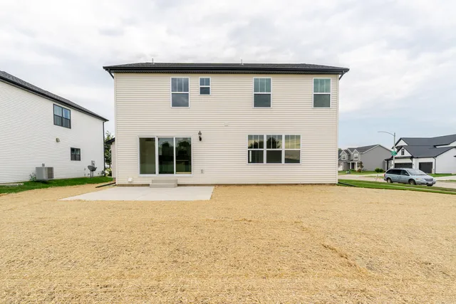 a view of a house with snow on the road