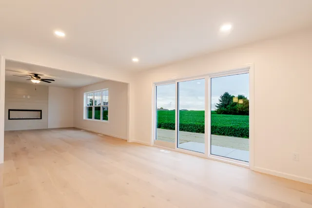 an empty room with windows and outdoor view