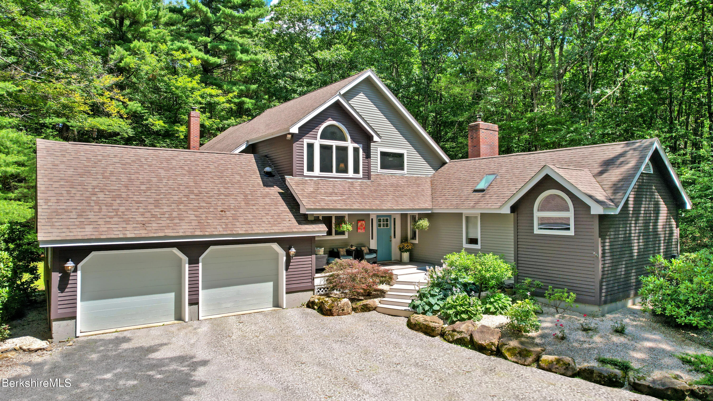 499 Norton Road Otis, MA 01029 - Photo 1 of 31 a front view of a house with a garden
