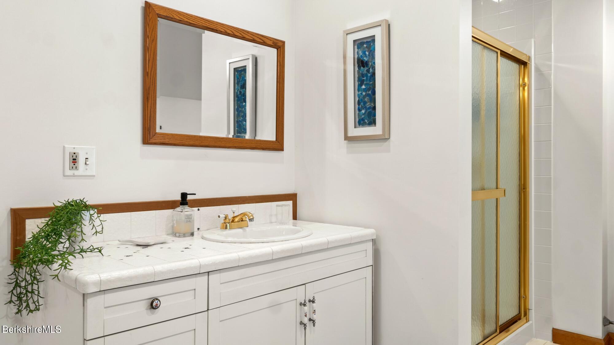 499 Norton Road Otis, MA 01029 - Photo 18 of 31 a bathroom with a sink and a mirror