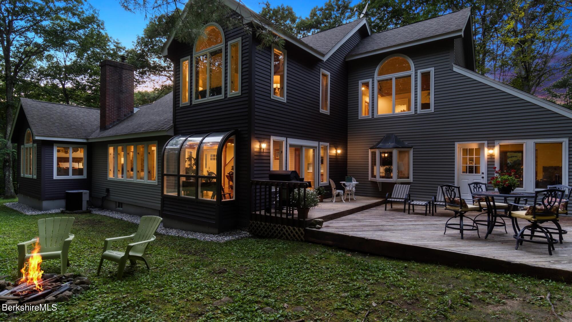 499 Norton Road Otis, MA 01029 - Photo 31 of 31 a view of a house with sitting area and garden