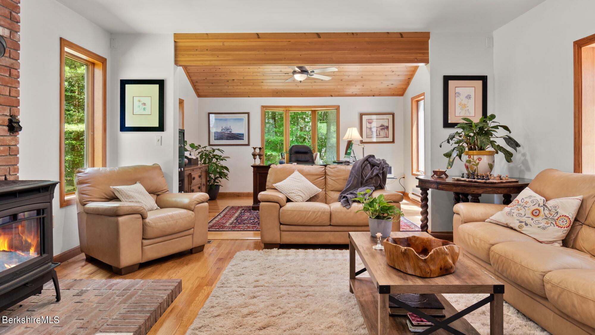 499 Norton Road Otis, MA 01029 - Photo 9 of 31 a living room with furniture and a large window