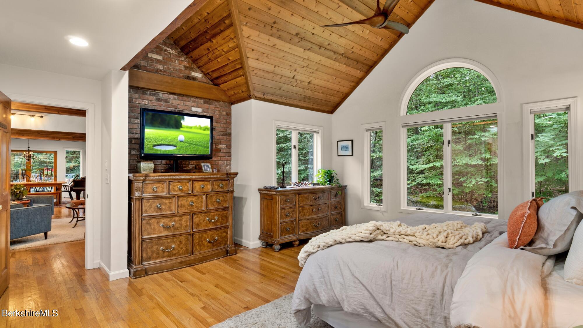 499 Norton Road Otis, MA 01029 - Photo 10 of 31 a bedroom with a bed and a flat screen tv
