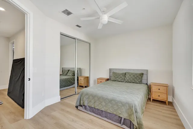 a bedroom with a large bed and a window