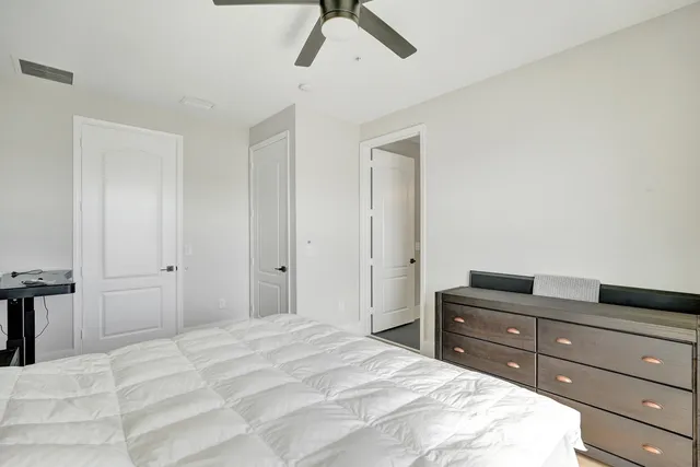 a bathroom with a sink a mirror and a shower