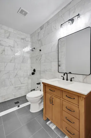 a bathroom with a double vanity sink and a mirror