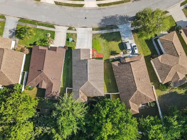 an aerial view of residential house with outdoor space and lake view