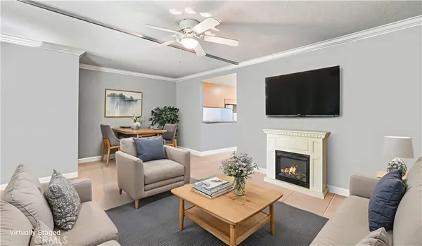 a living room with furniture a fireplace and a flat screen tv