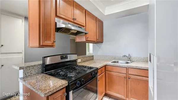 a kitchen with a stove and a sink