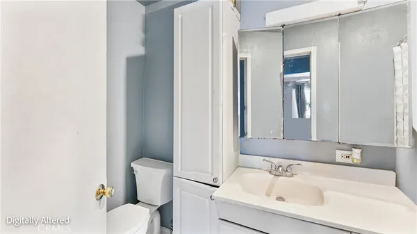 a bathroom with a sink and a toilet