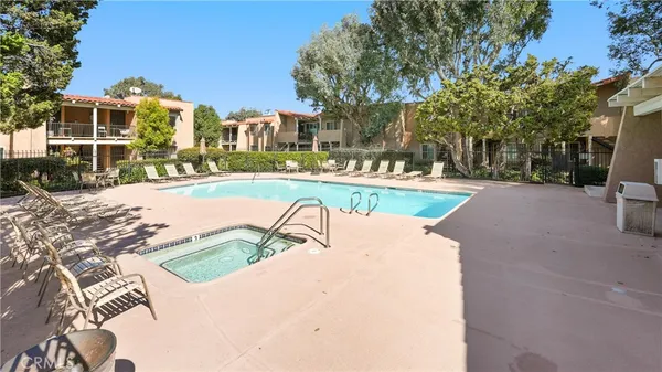 a view of a swimming pool with a patio