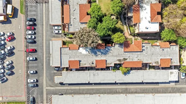 an aerial view of residential houses with outdoor space
