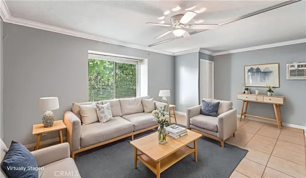 a living room with furniture and a large window