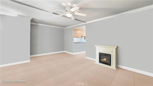 a view of empty room with fireplace and fan
