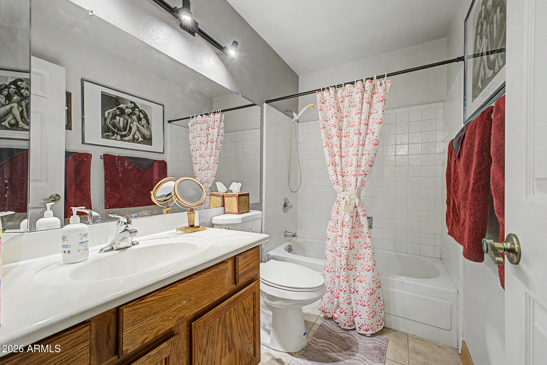 2659 West Hearn Road Phoenix, AZ 85023 - Photo 19 of 25 a bathroom with a sink toilet and shower