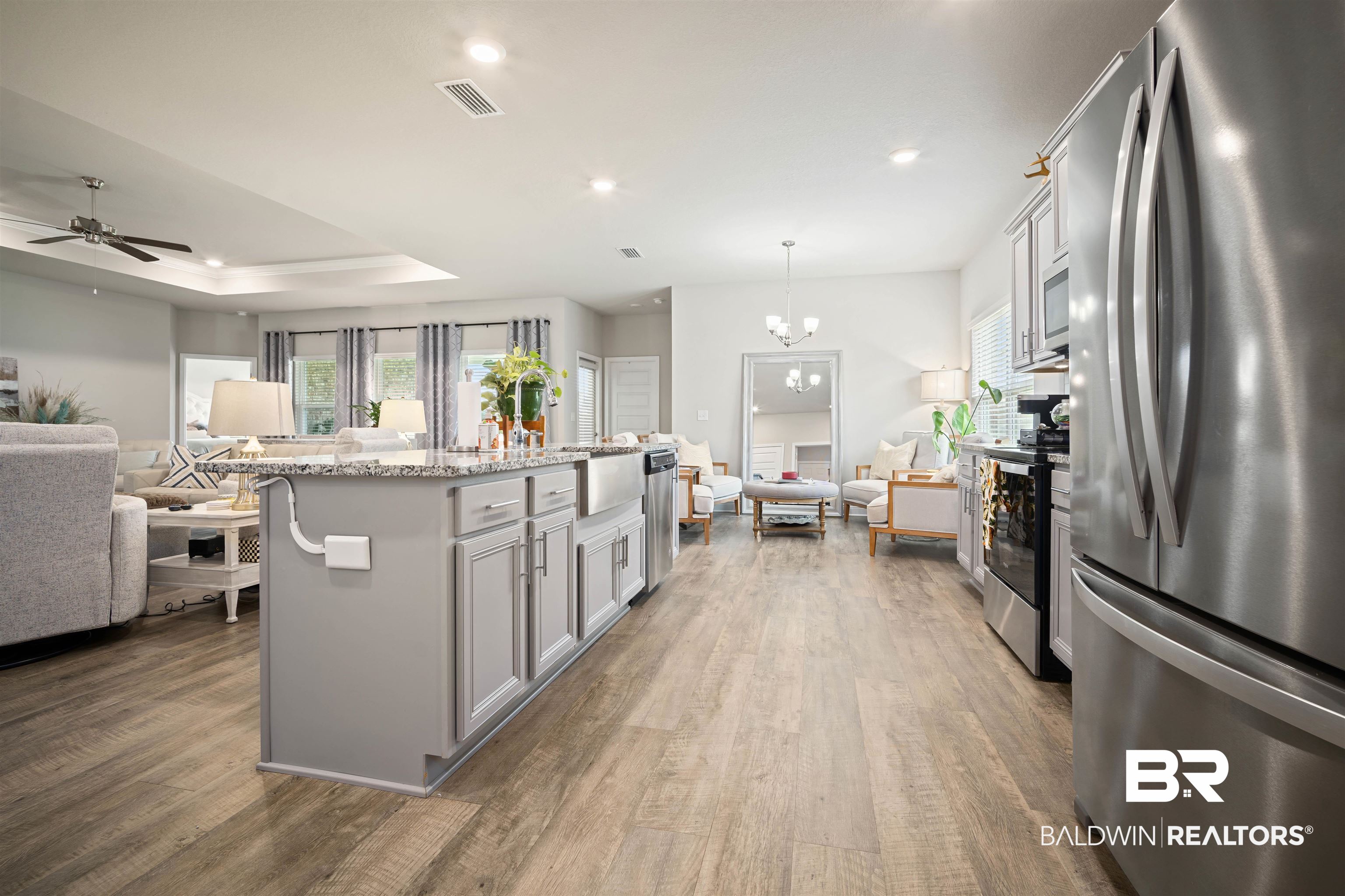 10474 Loamy Avenue Mobile, AL 36695 - Photo 30 of 31 Kitchen featuring open floor plan, appliances with stainless steel finishes, a tray ceiling, recessed lighting, and healthy amount of natural light